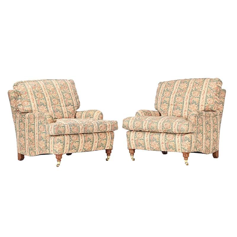 A pair of walnut and upholstered armchairs in Victorian taste, of recent manufacture after The Manner of Howard and Sons